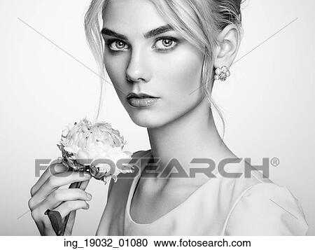 Portrait of beautiful sensual woman with elegant hairstyle. Perfect makeup. Blonde girl. Fashion photo. Flowers. Black and white View Large Photo Image Stock Image - Portrait of beautiful sensual woman with elegant hairstyle. Perfect makeup. Blonde girl. Fashion photo. Flowers. Black and white. Fotosearch