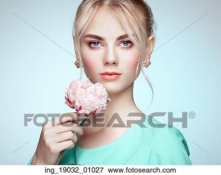 Portrait of beautiful sensual woman with elegant hairstyle. Perfect makeup. Blonde girl. Fashion photo. Flowers View Large Photo Image Stock Photo - Portrait of beautiful sensual woman with elegant hairstyle. Perfect makeup. Blonde girl. Fashion photo. Flowers. Fotosearch