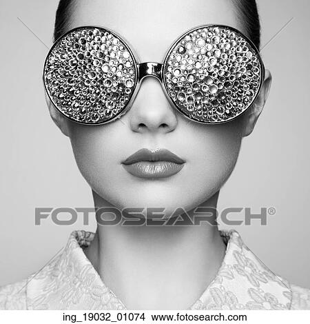 Portrait of beautiful young woman with colored glasses. Beauty fashion. Perfect make-up. Colorful decoration. Jewelry. Black and white View Large Photo Image Picture - Portrait of beautiful young woman with colored glasses. Beauty fashion. Perfect make-up. Colorful decoration. Jewelry. Black and white. Fotosearch
