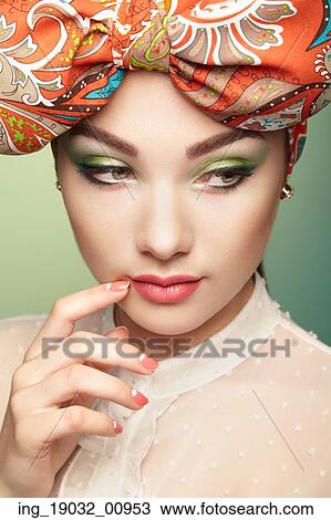 Portrait of beautiful young woman with bow. Brunette girl. Beauty fashion. Cosmetic make-up View Large Photo Image Stock Image - Portrait of beautiful young woman with bow. Brunette girl. Beauty fashion. Cosmetic make-up. Fotosearch