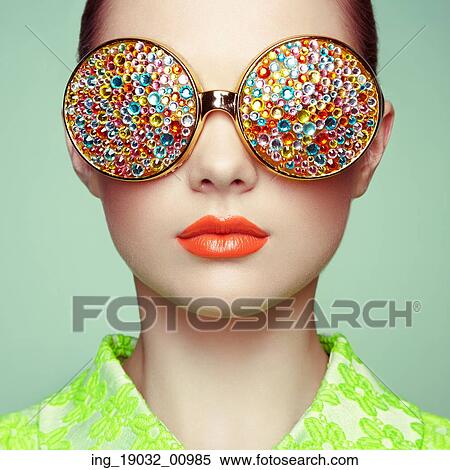 Portrait of beautiful young woman with colored glasses. Beauty fashion. Perfect make-up. Colorful decoration. Jewelry View Large Photo Image Stock Photography - Portrait of beautiful young woman with colored glasses. Beauty fashion. Perfect make-up. Colorful decoration. Jewelry. Fotosearch