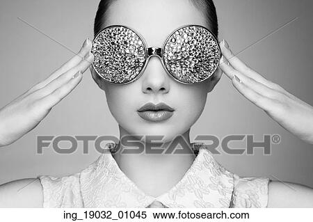 Portrait of beautiful young woman with colored glasses. Beauty fashion. Perfect make-up. Colorful decoration. Jewelry. Black and white View Large Photo Image Stock Photography - Portrait of beautiful young woman with colored glasses. Beauty fashion. Perfect make-up. Colorful decoration. Jewelry. Black and white. Fotosearch