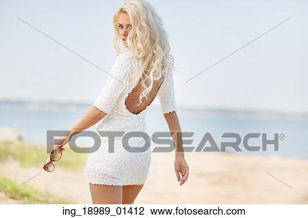 Stock Image - Portrait of lady enjoying the nature. Fotosearch