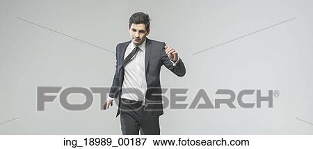 Stock Photo - Portrait of really successful young businessman. Fotosearch