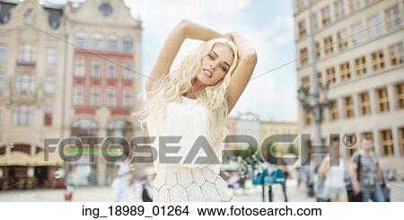 Picture - Portrait of the alluring lady in the old town. Fotosearch