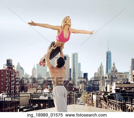 Stock Photography - Portrait of the cheerful athletes practising together. Fotosearch
