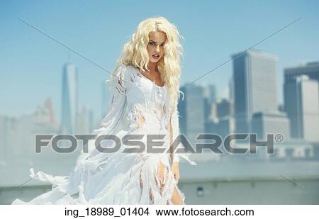 Picture - Portrait of the lady over the city background. Fotosearch