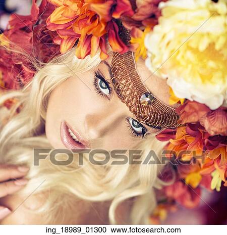 Stock Image - Portrait of the lady with the colorful wreath. Fotosearch