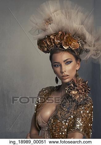 Portrait of the woman with gold hat View Large Photo Image Stock Image - Portrait of the woman with gold hat. Fotosearch