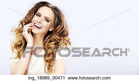 Stock Image - Portrait of the young cheerful fresh lady. Fotosearch