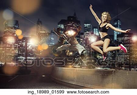 Stock Photo - Portrait of the young jumping athletes. Fotosearch