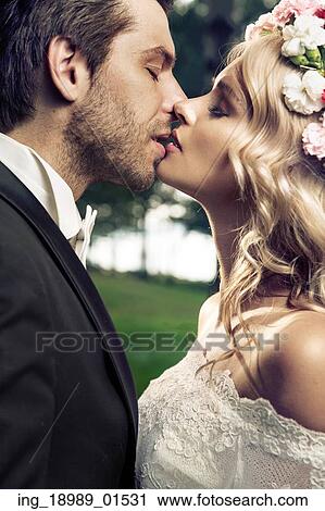 Portrait of the young kissing marriage couple View Large Photo Image Stock Image - Portrait of the young kissing marriage couple. Fotosearch