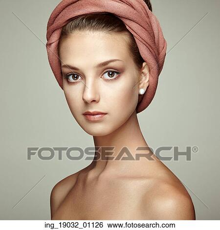 Stock Photograph - Portrait young beautiful brunette woman with elegant headdress. Beauty fashion. Eyelashes. Cosmetic Eyeshadow. Hair. Fotosearch