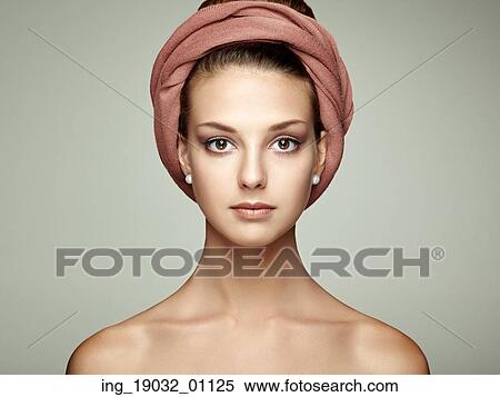 Stock Photography - Portrait young beautiful brunette woman with elegant headdress. Beauty fashion. Eyelashes. Cosmetic Eyeshadow. Hair. Fotosearch