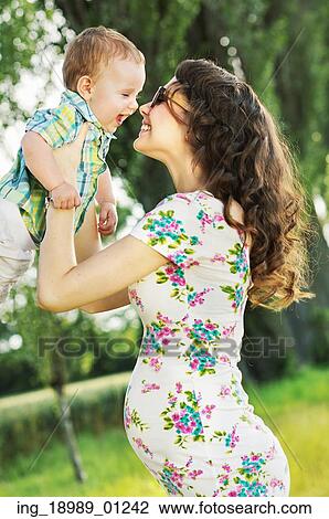 Stock Image - Pregnant mother with her little child. Fotosearch