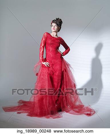 Stock Photo - Proud red queen in the fashion pose. Fotosearch