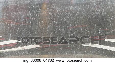 Rain falling on the asphalt of the street, Manhattan, New York City, New York State, USA View Large Photo Image Stock Image - Rain falling on the asphalt of the street, Manhattan, New York City, New York State, USA. Fotosearch