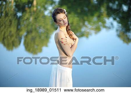 Stock Image - Realxed lady enjoying the nature. Fotosearch