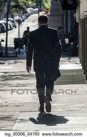 Rear View of a Buinessman walking on a street, Dumbo, Brooklyn, New York City, New York State, USA View Large Photo Image Stock Image - Rear View of a Buinessman walking on a street, Dumbo, Brooklyn, New York City, New York State, USA. Fotosearch