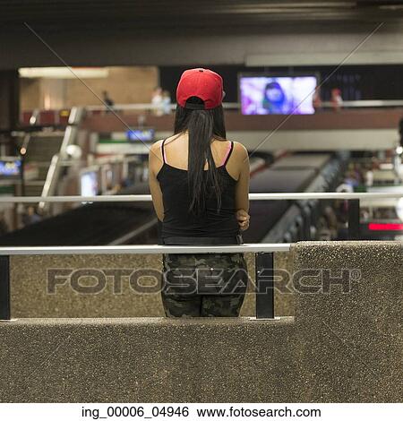 Rear view of a woman standing at Santiago Metro station, Santiago, Santiago Metropolitan Region, Chile View Large Photo Image Stock Photograph - Rear view of a woman standing at Santiago Metro station, Santiago, Santiago Metropolitan Region, Chile. Fotosearch
