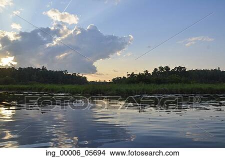 Reflection of clouds on water, Lake of the Woods, Ontario, Canada View Large Photo Image Picture - Reflection of clouds on water, Lake of the Woods, Ontario, Canada. Fotosearch