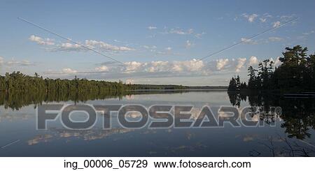 Reflection of clouds on water, Lake Of The Woods, Ontario, Canada View Large Photo Image Stock Photo - Reflection of clouds on water, Lake Of The Woods, Ontario, Canada. Fotosearch