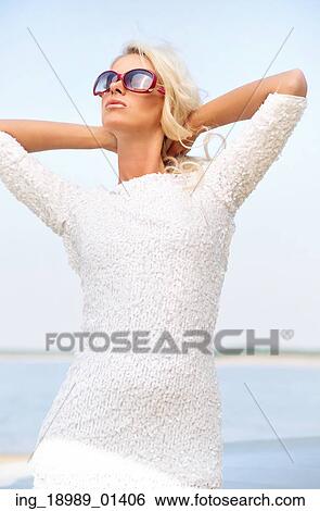 Relaxed woman with trendy sunglasses View Large Photo Image Stock Photograph - Relaxed woman with trendy sunglasses. Fotosearch