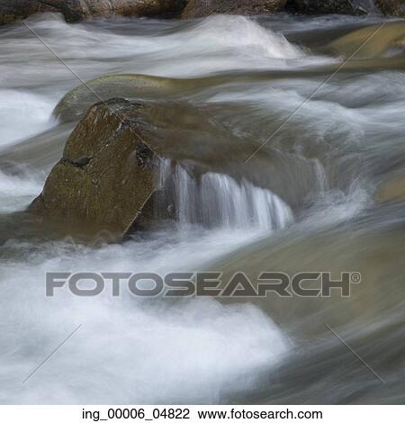 Stock Image - River flowing through rocks, Whistler, British Columbia, Canada. Fotosearch