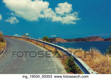 Stock Image - road to the beach. Phuket. Thailand. Fotosearch