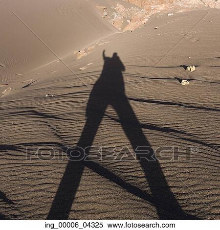 Shadow of a person on sand in desert, Valle de la Luna, San Pedro de Atacama, El Loa Province, Antofagasta Region, Chile View Large Photo Image Stock Photography - Shadow of a person on sand in desert, Valle de la Luna, San Pedro de Atacama, El Loa Province, Antofagasta Region, Chile. Fotosearch