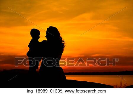 Silhouette of a young mother with her little baby View Large Photo Image Stock Photography - Silhouette of a young mother with her little baby. Fotosearch