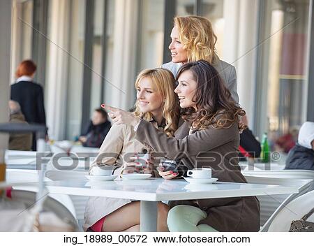Smart women looking at something interesting View Large Photo Image Stock Image - Smart women looking at something interesting. Fotosearch