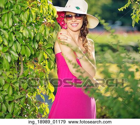 Smart young woman with stylish straw hat View Large Photo Image Stock Photo - Smart young woman with stylish straw hat. Fotosearch