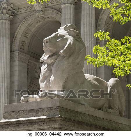 Stock Image - Statue of lion at New York Public Library, Midtown, Manhattan, New York City, New York State, USA. Fotosearch