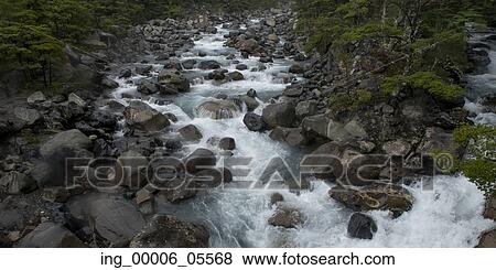 Stream flowing through rocks, French River, French Valley, Torres Del Paine National Park, Patagonia, Chile View Large Photo Image Stock Photo - Stream flowing through rocks, French River, French Valley, Torres Del Paine National Park, Patagonia, Chile. Fotosearch