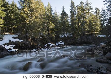 Stock Photo - Stream flowing through rocks, Whistler, British Columbia, Canada. Fotosearch