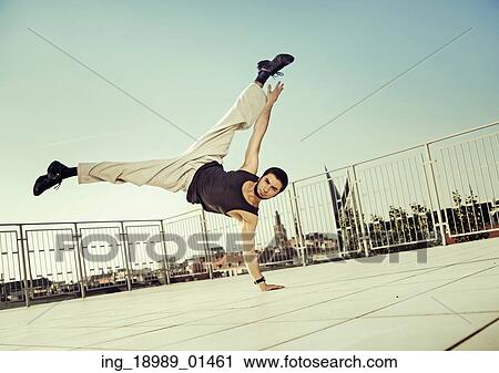Stock Image - Strong guy doing hard exercises. Fotosearch