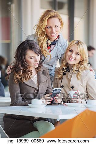 Three fabulous ladies drinking coffee View Large Photo Image Stock Photo - Three fabulous ladies drinking coffee. Fotosearch
