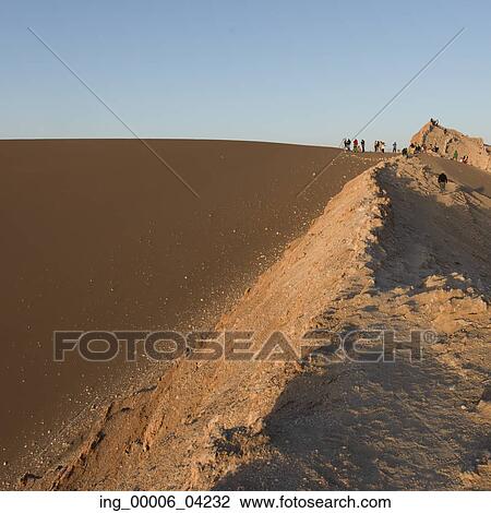 Stock Image - Tourists at Valle de la Luna, San Pedro de Atacama, El Loa Province, Antofagasta Region, Chile. Fotosearch