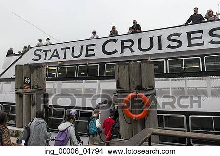 Picture - Tourists boarding a ship to the Statue of Liberty, Liberty Island, New York Harbor, Manhattan, New York City, New York State, USA. Fotosearch
