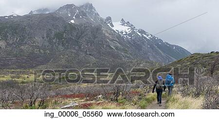Stock Image - Tourists hiking, Torres Del Paine National Park, Patagonia, Chile. Fotosearch
