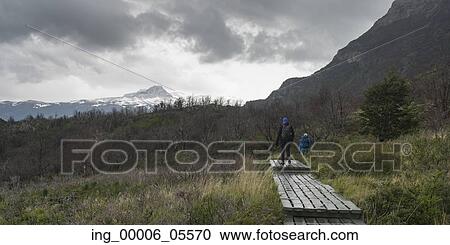 Tourists hiking, Torres Del Paine National Park, Patagonia, Chile View Large Photo Image Stock Image - Tourists hiking, Torres Del Paine National Park, Patagonia, Chile. Fotosearch