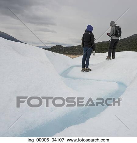 Stock Photo - Tourists in snow, Perito Moreno Glacier, Los Glaciares National Park, Santa Cruz Province, Patagonia, Argentina. Fotosearch