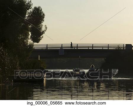 Stock Photography - Tourists on boats in a lake, Kenora, Lake Of The Woods, Ontario, Canada. Fotosearch