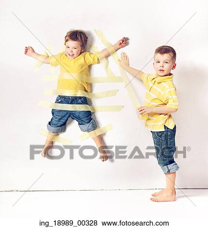 Two cute little brothers having great fun View Large Photo Image Stock Photo - Two cute little brothers having great fun. Fotosearch