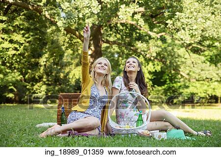 Two women looking at the pure nature View Large Photo Image Stock Photo - Two women looking at the pure nature. Fotosearch