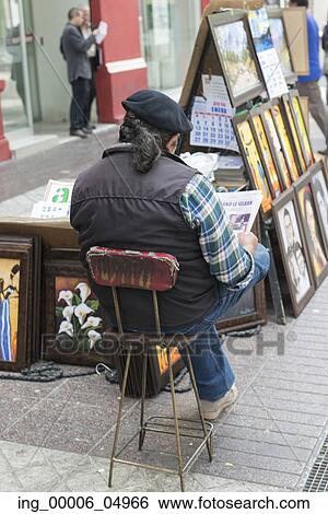 Vendor selling paintings on street, Santiago, Santiago Metropolitan Region, Chile View Large Photo Image Stock Photograph - Vendor selling paintings on street, Santiago, Santiago Metropolitan Region, Chile. Fotosearch
