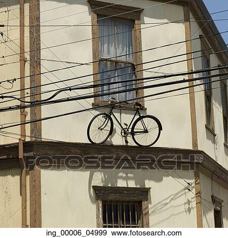 View of a bicycle on the ledge of a house, Valparaiso, Chile View Large Photo Image Stock Photo - View of a bicycle on the ledge of a house, Valparaiso, Chile. Fotosearch