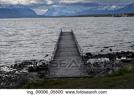 Stock Image - View of a jetty at lake, Golfo Almirante Montt, Puerto Natales, Patagonia, Chile. Fotosearch