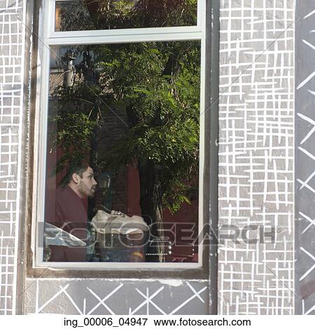 View of a man through window, Santiago, Santiago Metropolitan Region, Chile View Large Photo Image Stock Photo - View of a man through window, Santiago, Santiago Metropolitan Region, Chile. Fotosearch